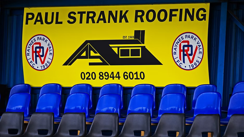 Pitchside advertising boards at Raynes Park Vale FC