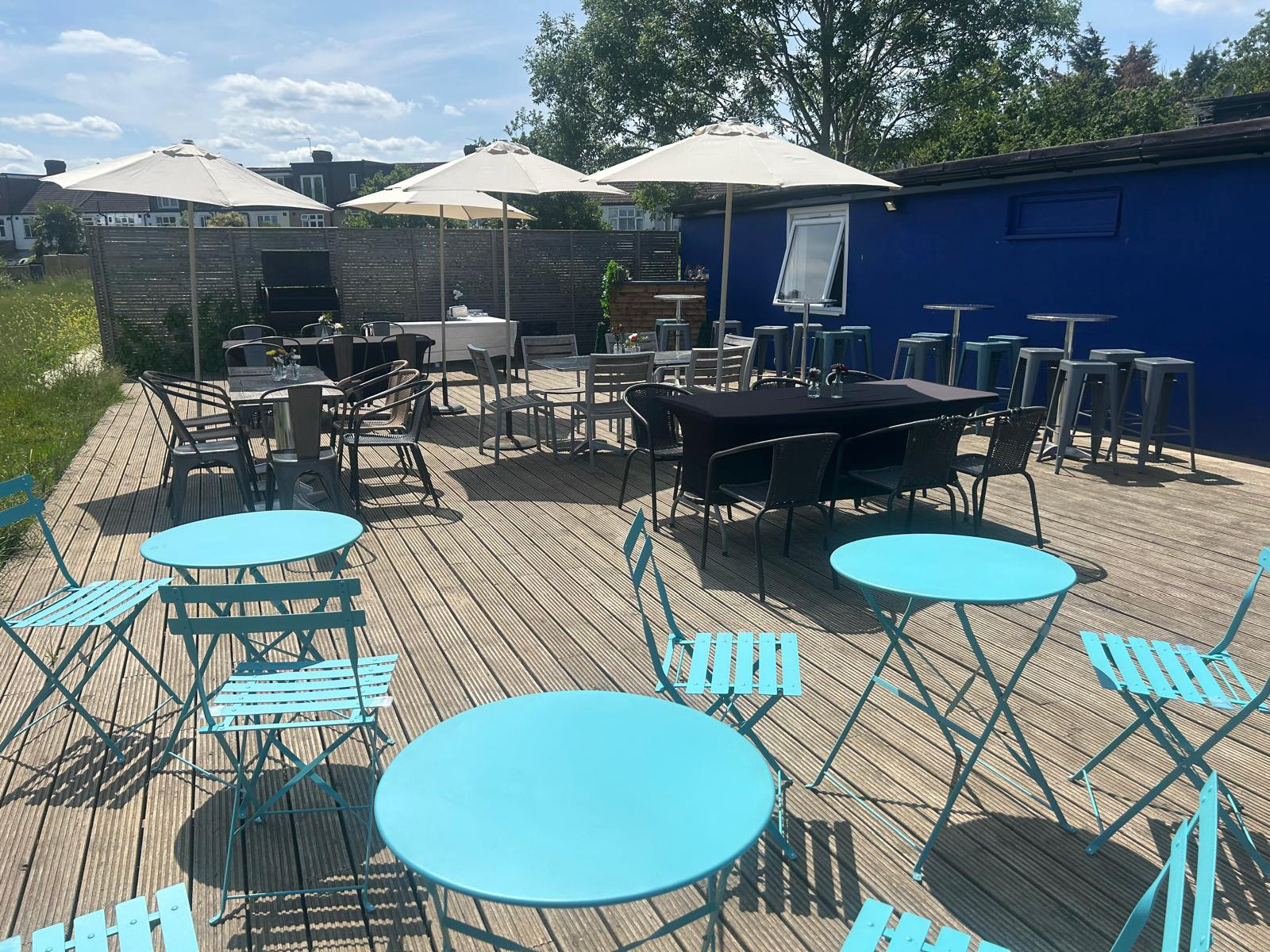 Outdoor terrace seating at The Vale Clubhouse